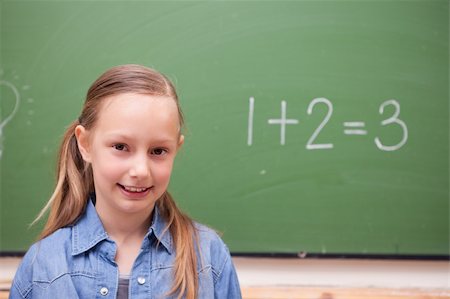 simsearch:625-01250891,k - Schoolgirl standing up in front of a blackboard Stock Photo - Budget Royalty-Free & Subscription, Code: 400-05894742