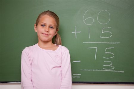 simsearch:625-01250891,k - Girl standing up  in front a blackboard Stock Photo - Budget Royalty-Free & Subscription, Code: 400-05895041