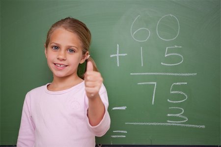 simsearch:625-01250891,k - Cute schoolgirl with the thumb up in front of a blackboard Stock Photo - Budget Royalty-Free & Subscription, Code: 400-05895043