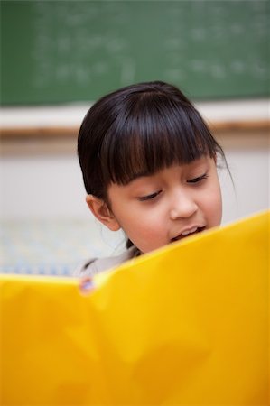 simsearch:400-05896357,k - Portrait of a schoolgirl reading in a classroom Stock Photo - Budget Royalty-Free & Subscription, Code: 400-05895090