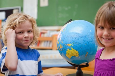 simsearch:630-03482408,k - Pupils posing in front of a globe in a classroom Stock Photo - Budget Royalty-Free & Subscription, Code: 400-05895398