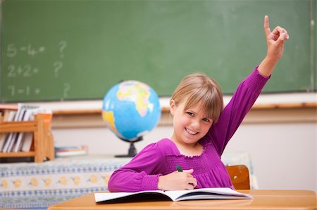 simsearch:400-05896357,k - Schoolgirl raising her hand to ask a question in a classroom Stock Photo - Budget Royalty-Free & Subscription, Code: 400-05895405