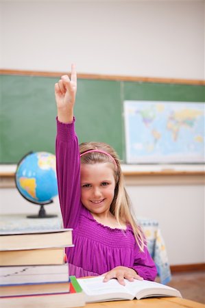 simsearch:400-05896357,k - Portrait of young schoolgirl raising her hand in a classroom Stock Photo - Budget Royalty-Free & Subscription, Code: 400-05895418
