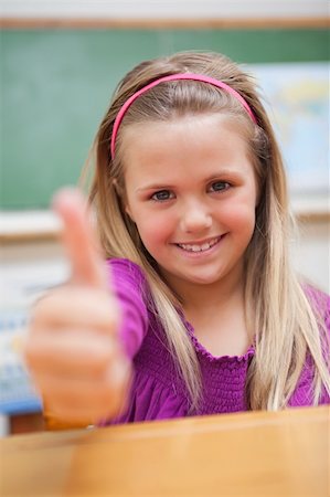 simsearch:400-05896424,k - Portrait of a schoolgirl with the thumb up in a classroom Stock Photo - Budget Royalty-Free & Subscription, Code: 400-05895485