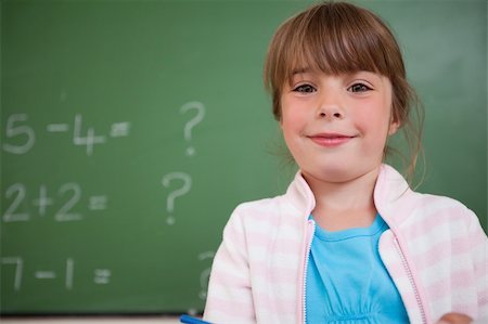 simsearch:400-05896357,k - Little girl standing up in front of a blackboard Stock Photo - Budget Royalty-Free & Subscription, Code: 400-05895494