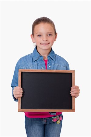 simsearch:400-05896424,k - Portrait of a young girl holding a school slate against a white background Stock Photo - Budget Royalty-Free & Subscription, Code: 400-05895525