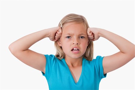simsearch:400-06363059,k - Angry girl with the fists on her face against a white background Stock Photo - Budget Royalty-Free & Subscription, Code: 400-05895558