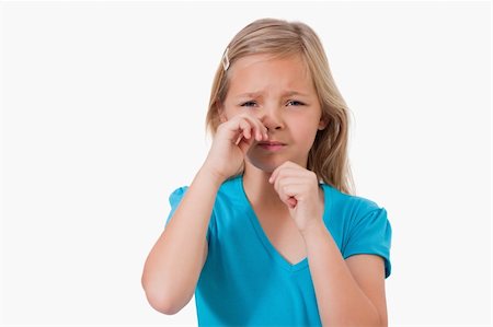 simsearch:400-04180936,k - Lonely little girl crying against a white background Photographie de stock - Aubaine LD & Abonnement, Code: 400-05895560