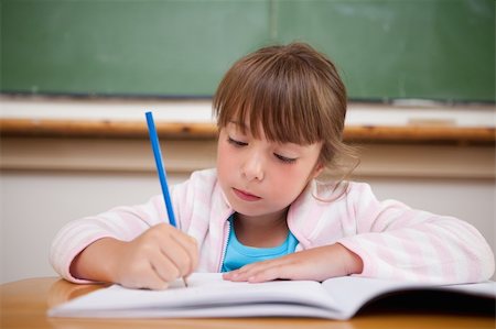 simsearch:400-05896357,k - Serious girl writing in a classroom Stock Photo - Budget Royalty-Free & Subscription, Code: 400-05895615