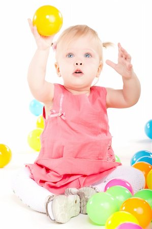 simsearch:400-04847852,k - Little baby girl playing with balls isolated on white Stock Photo - Budget Royalty-Free & Subscription, Code: 400-05895840