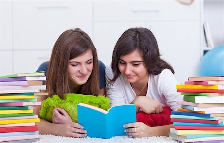 simsearch:400-05357982,k - Teenager girls with lots of books study and read together Stock Photo - Budget Royalty-Free & Subscription, Code: 400-05896174