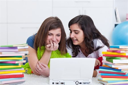 simsearch:400-05357982,k - Teen girls having fun searching the internet together Stock Photo - Budget Royalty-Free & Subscription, Code: 400-05896177
