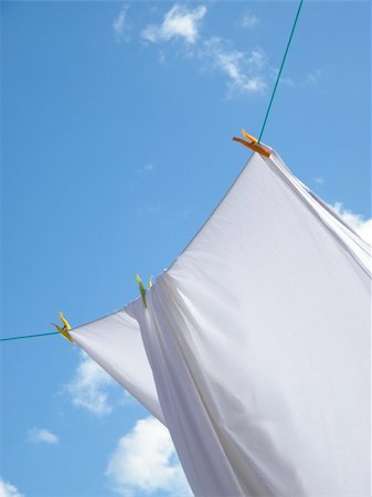 peg - Photo of a white sheet hanging on a clothes line Stock Photo - Budget Royalty-Free & Subscription, Code: 400-05896221