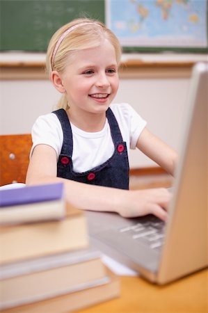 simsearch:400-05896357,k - Portrait of a girl using a laptop in a classroom Stock Photo - Budget Royalty-Free & Subscription, Code: 400-05896329