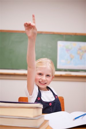 simsearch:400-05896357,k - Portrait of a girl raising her hand in a classroom Stock Photo - Budget Royalty-Free & Subscription, Code: 400-05896335