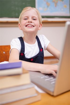 simsearch:400-05896357,k - Portrait of a girl using a notebook in a classroom Stock Photo - Budget Royalty-Free & Subscription, Code: 400-05896330