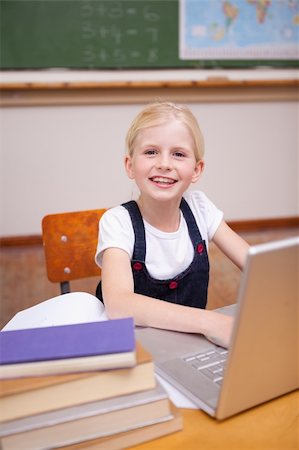 simsearch:400-05896357,k - Portrait of a little girl using a notebook in a classroom Stock Photo - Budget Royalty-Free & Subscription, Code: 400-05896332