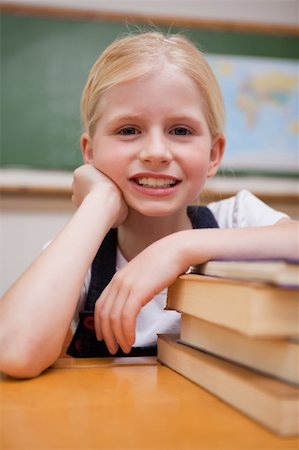 simsearch:400-05896357,k - Portrait of a girl leaning on books in a classroom Stock Photo - Budget Royalty-Free & Subscription, Code: 400-05896340