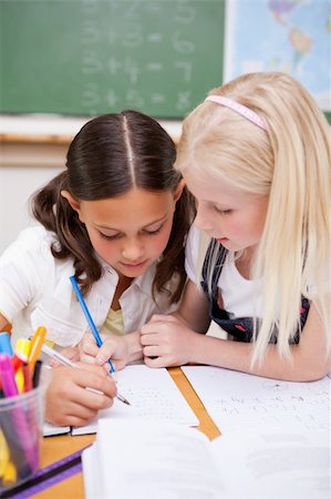 simsearch:6109-06196438,k - Portrait of pupils working together on an assignment in a classroom Stock Photo - Budget Royalty-Free & Subscription, Code: 400-05896369
