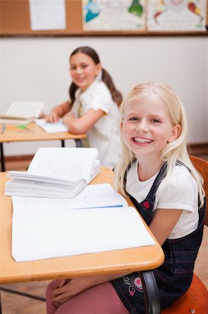 simsearch:400-05896357,k - Portrait of pupils smiling at the camera in a classroom Stock Photo - Budget Royalty-Free & Subscription, Code: 400-05896361