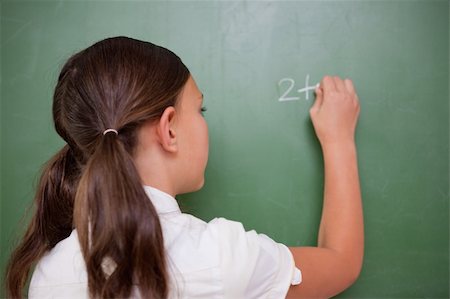 simsearch:625-01250891,k - Schoolgirl writing an addition on a blackboard Stock Photo - Budget Royalty-Free & Subscription, Code: 400-05896384
