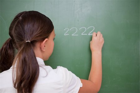 simsearch:400-05896357,k - Girl writing numbers on a blackboard Stock Photo - Budget Royalty-Free & Subscription, Code: 400-05896387
