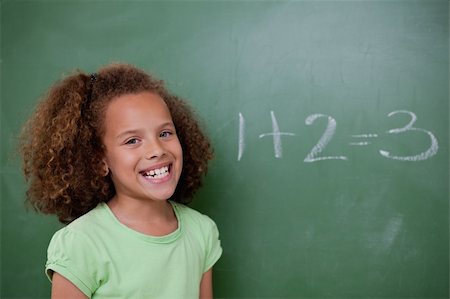 simsearch:625-01250891,k - Schoolgirl posing in front of an addition on a blackboard Stock Photo - Budget Royalty-Free & Subscription, Code: 400-05896394