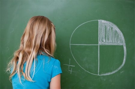 simsearch:400-05896357,k - Schoolgirl learning the divisions on a blackboard Stock Photo - Budget Royalty-Free & Subscription, Code: 400-05896499