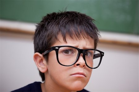 pictures of goofy in the classroom - Close up of a serious schoolboy in a classroom Stock Photo - Budget Royalty-Free & Subscription, Code: 400-05896536