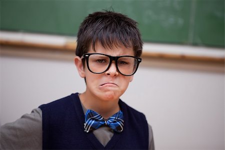 pictures of goofy in the classroom - Grumpy schoolboy posing in a classroom Stock Photo - Budget Royalty-Free & Subscription, Code: 400-05896538