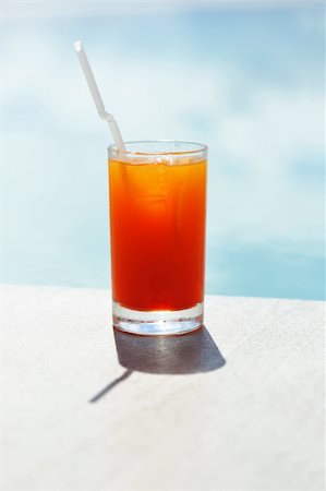 Cocktail near the swimming pool,  shallow depth of field Stock Photo - Budget Royalty-Free & Subscription, Code: 400-05897467