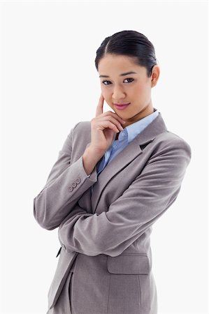 simsearch:400-05729275,k - Portrait of a smiling businesswoman thinking against a white background Stock Photo - Budget Royalty-Free & Subscription, Code: 400-05898610