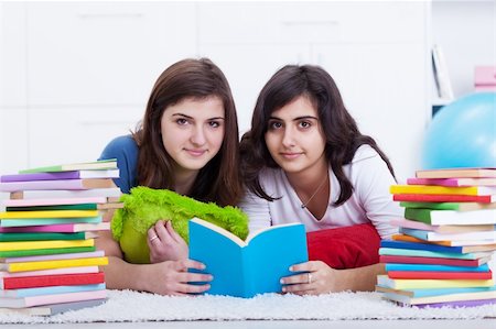 simsearch:400-05357982,k - Tutoring concept - girls learning together with lots of books Stock Photo - Budget Royalty-Free & Subscription, Code: 400-05899240
