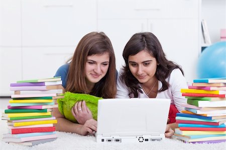 simsearch:400-05357982,k - Friends in college together - beautiful girls study with books and laptop Stock Photo - Budget Royalty-Free & Subscription, Code: 400-05899241