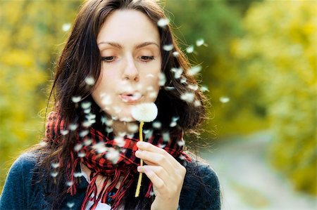 simsearch:400-04399510,k - Girl blowing on white dandelion in the forest Stock Photo - Budget Royalty-Free & Subscription, Code: 400-05899558