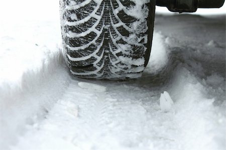 Winter tires in the snow close-up Stock Photo - Budget Royalty-Free & Subscription, Code: 400-05891230