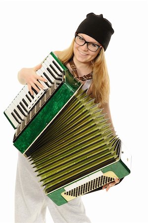 Portrait of the girl, playing an accordion in a cap and glasses Stock Photo - Budget Royalty-Free & Subscription, Code: 400-05892164