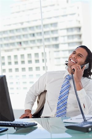 simsearch:859-06710917,k - Portrait of a delighted businessman on the phone in his office Stock Photo - Budget Royalty-Free & Subscription, Code: 400-05892349
