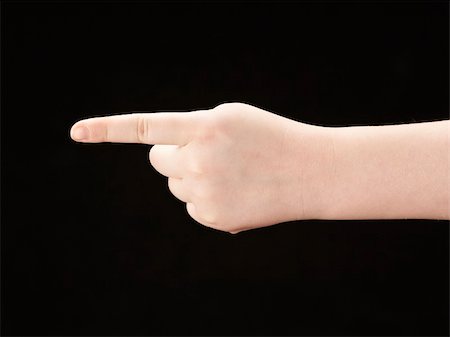 simsearch:400-04586134,k - Childs hand with index finger pointing - black background Stock Photo - Budget Royalty-Free & Subscription, Code: 400-05906366