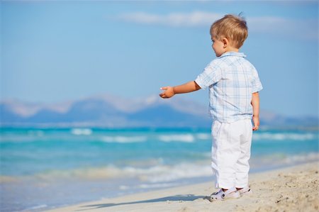 simsearch:400-04423521,k - Little cute boy on the beautiful exotic white beach, Mallorca, Spain Photographie de stock - Aubaine LD & Abonnement, Code: 400-05909878