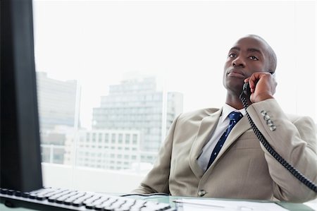simsearch:859-06710917,k - Businessman on the phone in his office Stock Photo - Budget Royalty-Free & Subscription, Code: 400-05900737