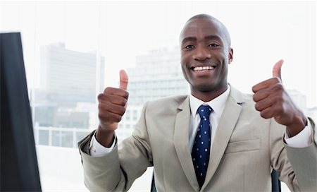 Businessman working with a computer with the thumbs up in his office Stock Photo - Budget Royalty-Free & Subscription, Code: 400-05900755