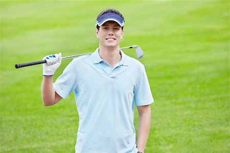 simsearch:400-05753039,k - A young man with a stick on the golf course Photographie de stock - Aubaine LD & Abonnement, Code: 400-05901248