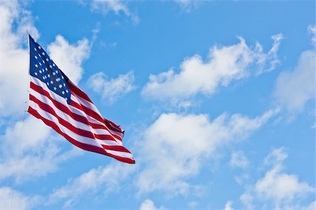 simsearch:400-06389956,k - American flag on a blue sky during a windy day Photographie de stock - Aubaine LD & Abonnement, Code: 400-05902840