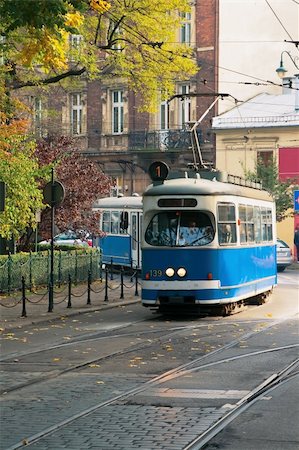 simsearch:862-06541761,k - The tram is moving down the street, autumn-colored trees, the autumn sun Stock Photo - Budget Royalty-Free & Subscription, Code: 400-05914269