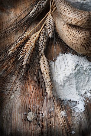 Wheat ears and flour sack on grunge wooden board Stock Photo - Budget Royalty-Free & Subscription, Code: 400-05914507