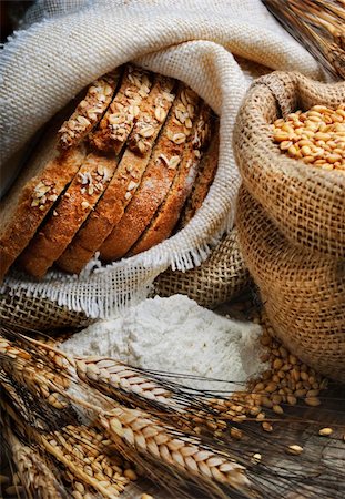 farm sack - Bread and wheat ears on vintage wooden board Stock Photo - Budget Royalty-Free & Subscription, Code: 400-05914509
