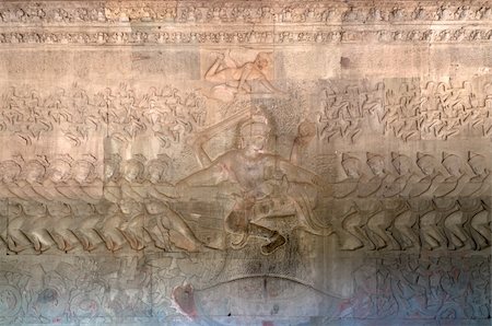 The bas-relief of the Churning of the Sea of Milk shows Vishnu in the centre, his turtle Avatar Kurma below, asuras and devas to left and right, and apsaras and Indra above. Angkor Wat. Cambodia Stock Photo - Budget Royalty-Free & Subscription, Code: 400-05915040