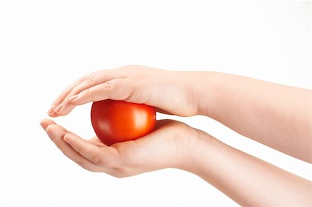 simsearch:400-04586134,k - Tomatoe sandwiched between childs hands - on white background Stock Photo - Budget Royalty-Free & Subscription, Code: 400-05911031