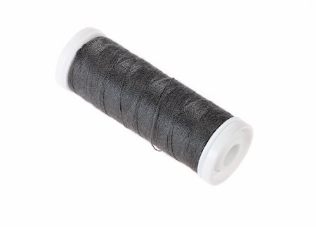 simsearch:6109-08701535,k - Black bobbin thread isolated on white Stock Photo - Budget Royalty-Free & Subscription, Code: 400-05911300